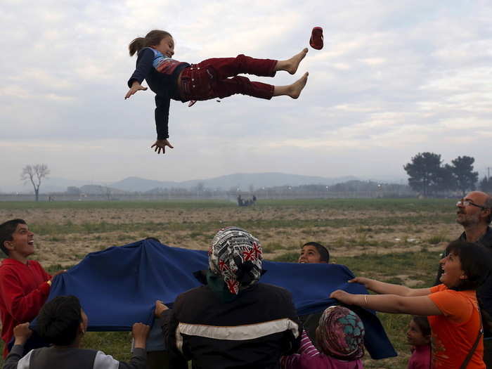 Children played at a makeshift camp for migrants and refugees at the Greek-Macedonian border near the village of Idomeni, Greece.