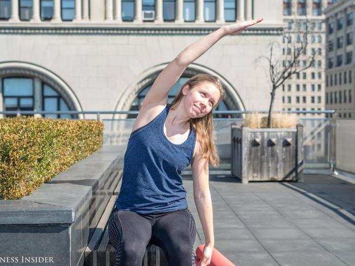 Next: the trunk lateral flexion. Bending on one side, reach your hand up and over, like it