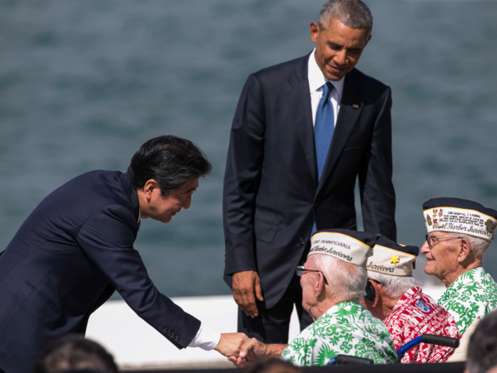 Obama and Abe greet Pearl Harbor survivors.