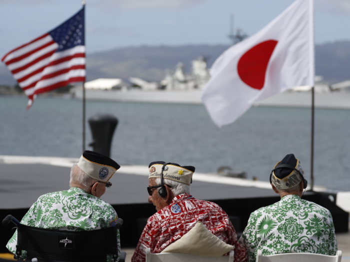 Three Pearl Harbor survivors wait for President Obama to speak.