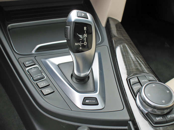 That eDrive button on the base of the shifter allows you to switch between all-electric and hybrid modes.