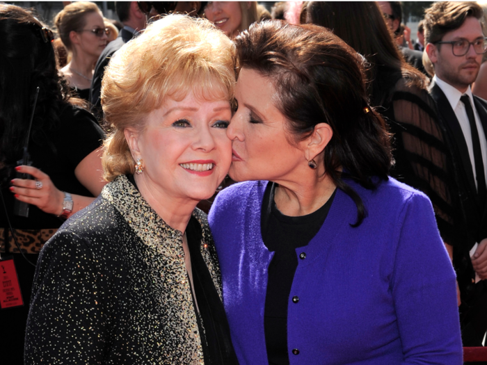 Carrie Fisher kisses her mother at the Primetime Creative Arts Emmy Awards on Saturday Sept. 10, 2011 in Los Angeles.