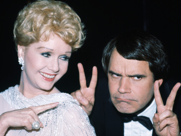 Reynolds with comedian Rich Little in Los Angeles on March 20, 1982.