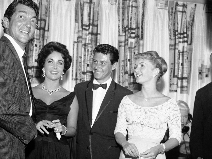 Dean Martin, Elizabeth Taylor, Eddie Fisher, and Debbie Reynolds, from left to right, are shown attending an opening show starring Fisher at the Tropicana, June 19, 1958, Las Vegas, Nev. Later that year, Eddie Fisher left Debbie Reynolds for Elizabeth Taylor.