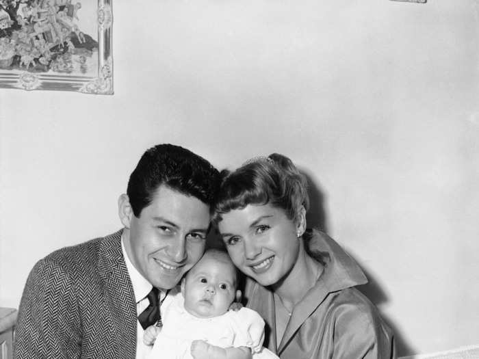 Fisher and Reynolds, with their young daughter, Carrie Frances Fisher, pose for their first family portrait, in Hollywood on Jan. 2, 1957. Carrie Frances was born Oct.21, 1956. The young stars, appropriately, appeared in the film, "Bundle of Joy" the same year.