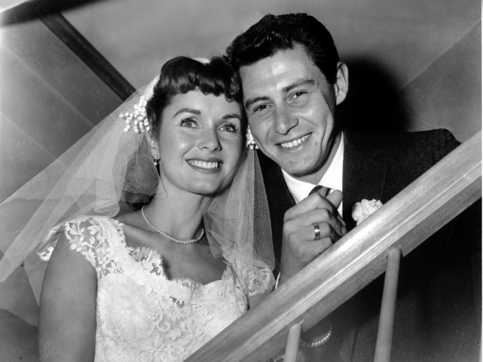 Reynolds and Fisher smile following their marriage ceremony by a county judge in Grossinger, New York, on Sept. 26, 1955.