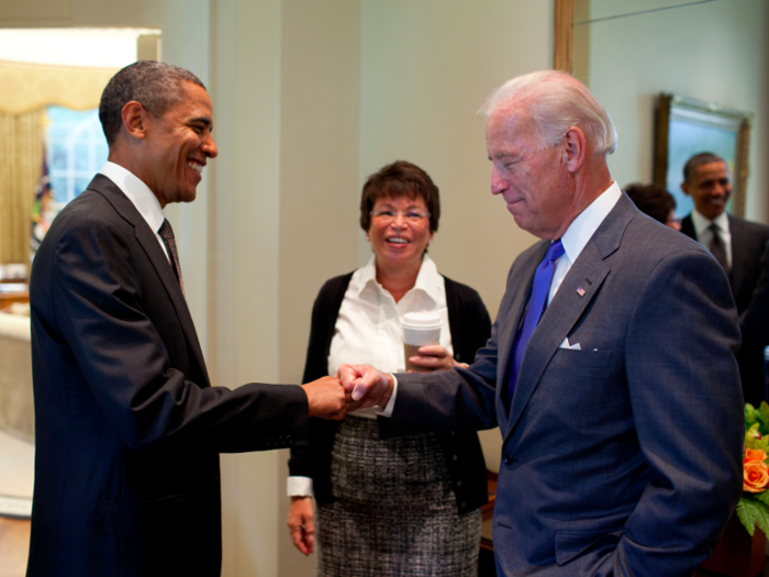 Obama fist-bumps Biden, as Senior Adviser Valerie Jarrett looks on, before a meeting in the Oval Office on September 16, 2010.