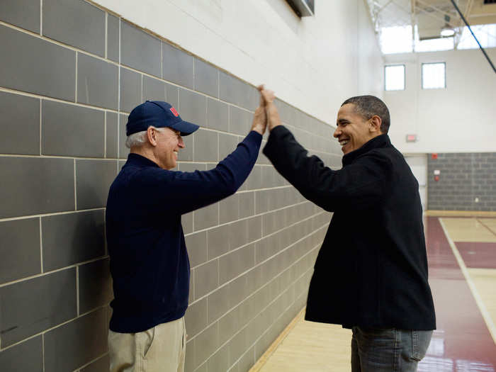 Obama and Biden high-five after watching Sasha Obama and Maisy Biden, the vice president