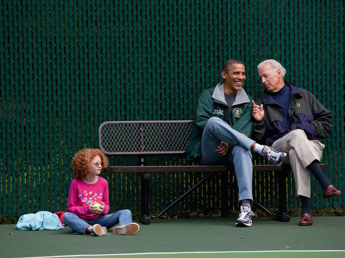 Obama, Biden, and Claire Duncan, daughter of then Education Secretary Arne Duncan, watch a tennis match at Camp David, Maryland, on October 3, 2010.