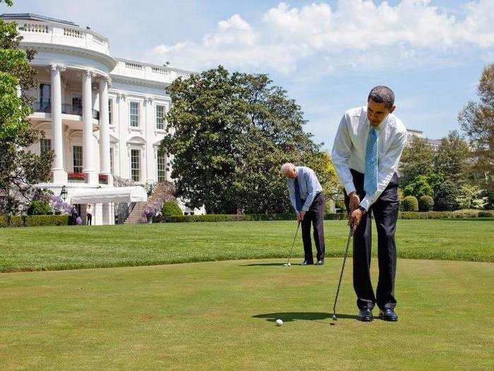 Obama and Biden practice their putting on the White House putting green on April 24, 2009.