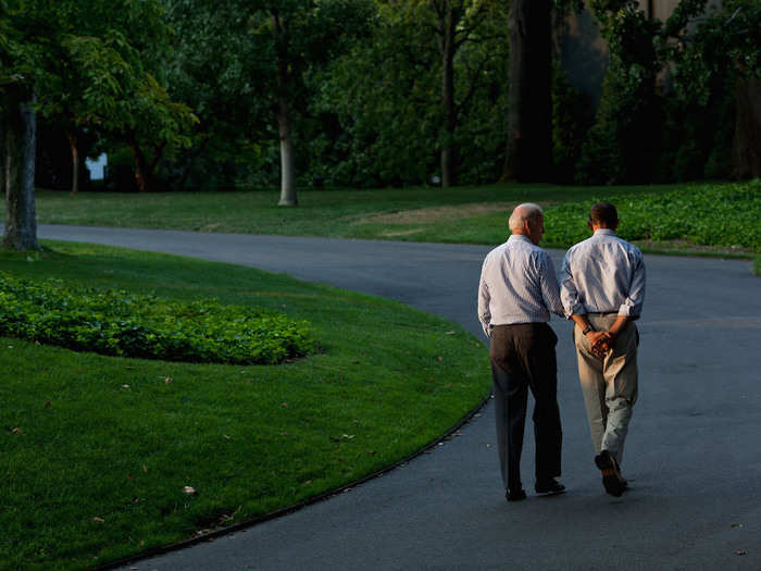 Obama and Biden walk around the South Lawn of the White House on July 24, 2011.