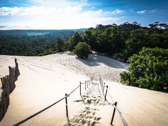 Climb the highest dune in Europe: the 351-foot-tall Dune du Pilat in the south of France.