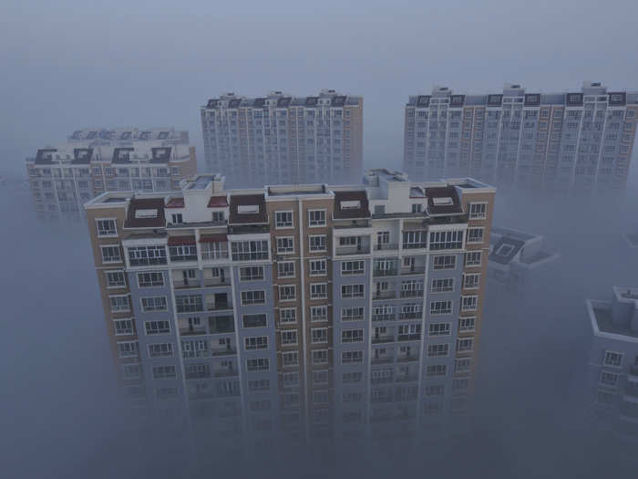 The tops of these residential compounds in Wujiaqu just barely make it above the smog.