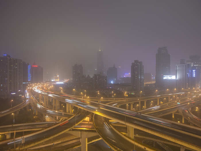 The lights of downtown Shanghai appear dim due to the haze.