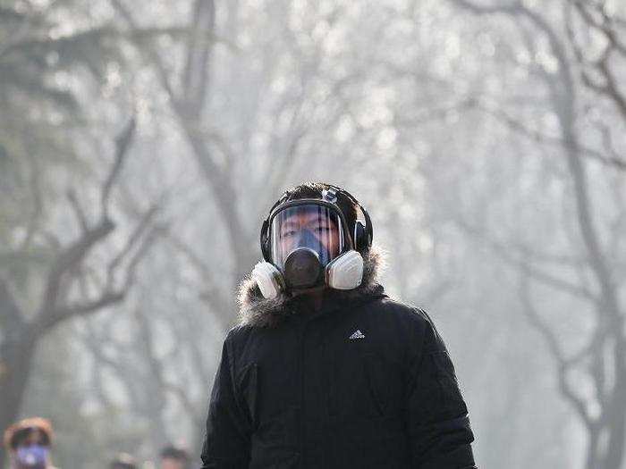 Some take more drastic measures to guard themselves from the pollution, such as this man wearing a full-on respirator in Beijing.