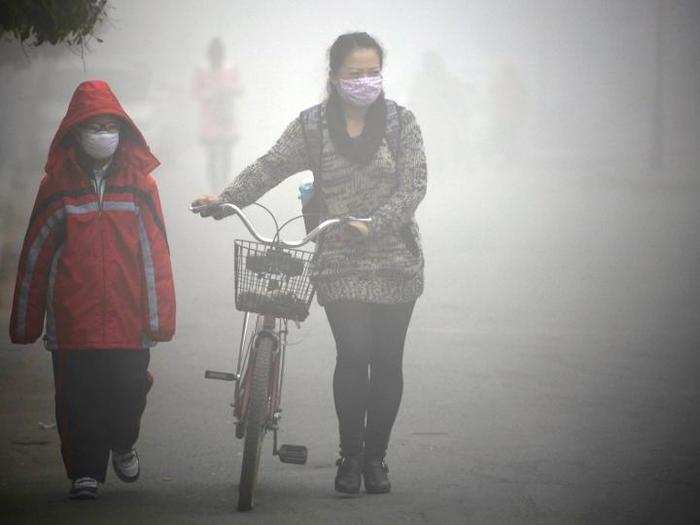 This woman and a young boy also choose to wear masks while in Jillin.