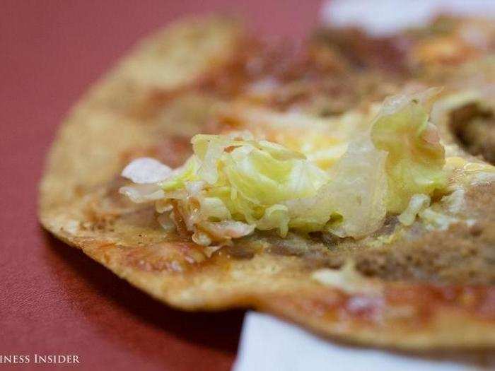 The lettuce, which was wet with a mild salsa, spilled out the sides.