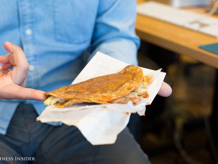 When they arrive at restaurants, cooks dump the pre-filled tortillas into a deep fryer, giving them their crusty outer rims. The meat clumps in the center.