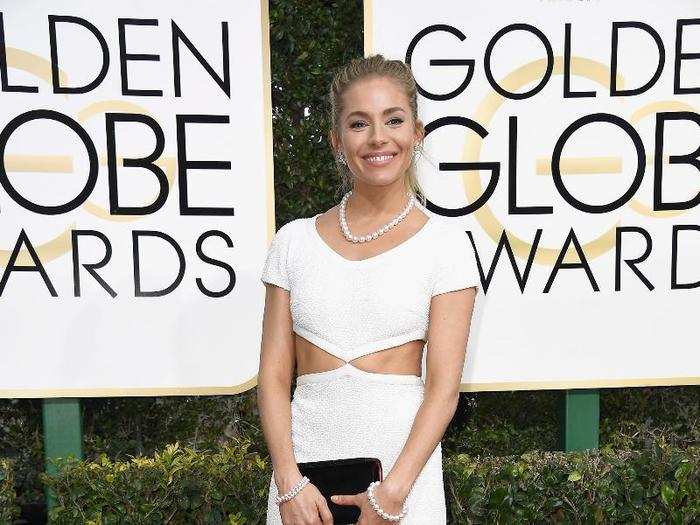 Sienne Miller showed off her obliques in this white dress.