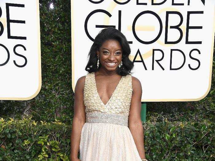 Simone Biles smiled wide on the carpet.