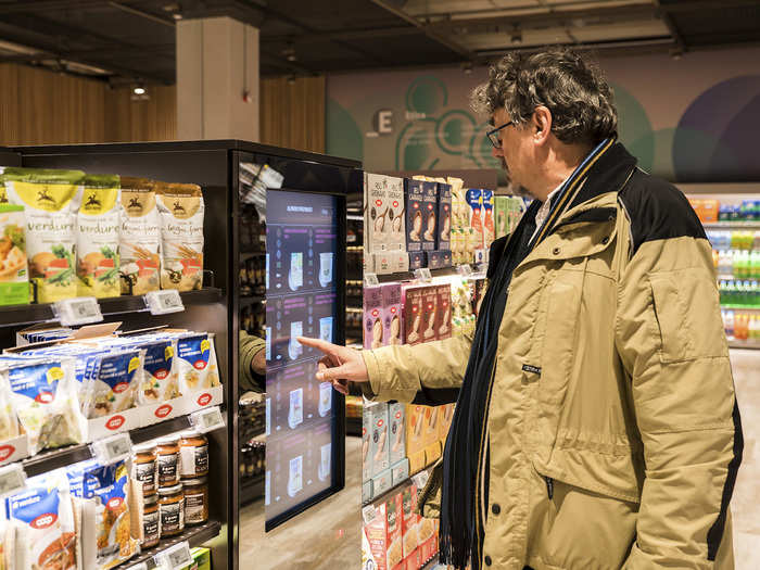 Food sits on short bookcase-like shelves. The idea is that, since customers can see into the next aisle, they might strike up a conversation with a stranger.