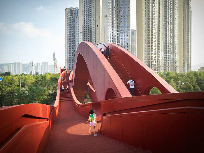 The 600-foot bridge is actually three separate bridges intertwined into one. Pedestrians can access it from eight street entrances.