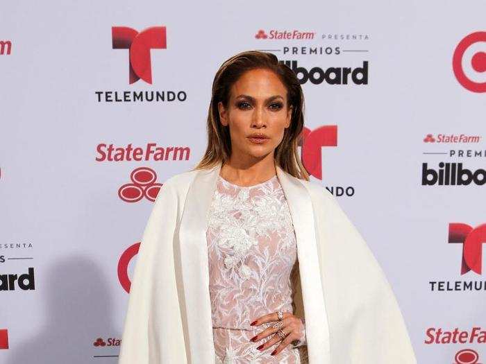 Wearing another cape, Lopez attended the Latin Billboard Awards later that year in a white lace jumpsuit.