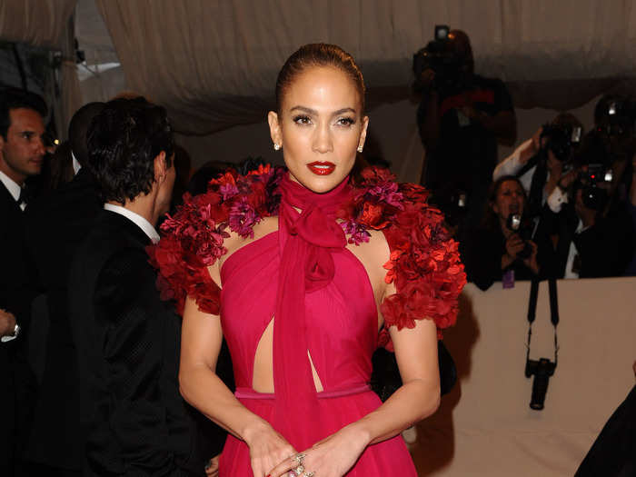 JLo looked fierce at the 2011 Met Gala in red and a high-neck, both of which she doesn