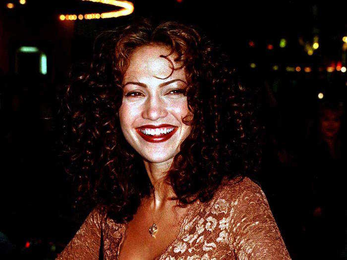 That same year, Lopez rocked curls and a tight-fitting beige, floral dress for the premiere of "Anaconda."