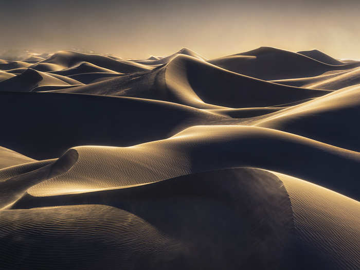 Alex Noriega won the "International Landscape Photographer of the Year" award for his body of work. Here we see wind and golden light on the sand dunes of Death Valley, California.