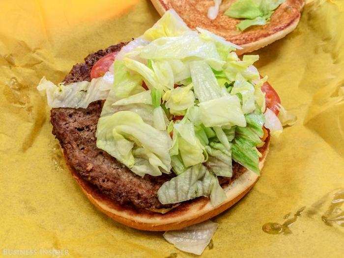 The patty is very thin and wide, which makes it much easier to grip the burger and keep all the toppings (onions, pickles, tomato, lettuce, and mustard) from spilling out.