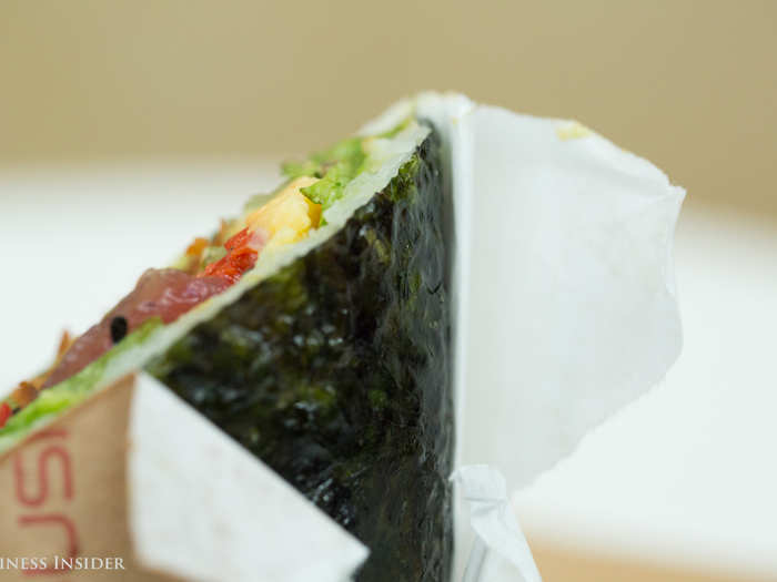 Seaweed paper and white rice held together the tightly packed ingredients.