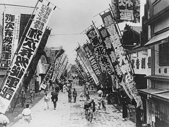 Despite the extreme loss in life and infrastructure, the city slowly recovered over the next few decades. Here is a street in Tokyo