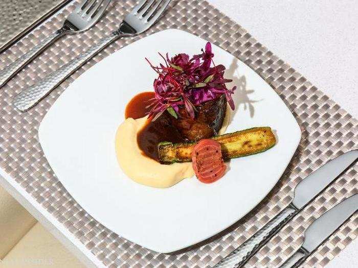 An elegantly plated beef brisket is surrounded by an odd, vegetal parsnip puree, roasted zucchini and beets, and a slick of rich au jus. The meat is impossibly tender, while the parsnip puree falls flat amongst the lustrous beef.