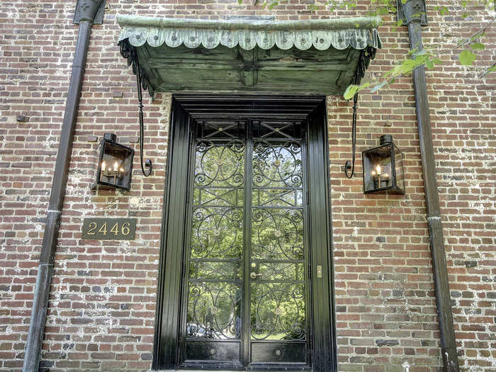 Fake gas lanterns flank the entrance.