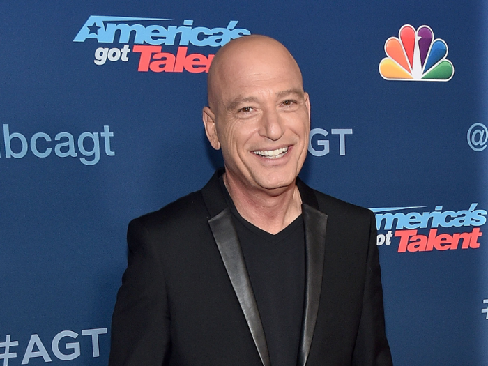 Actor and game show host Howie Mandel ran down the hall in a gorilla costume.