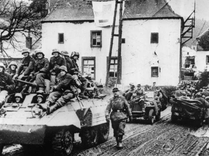 During the last German counteroffensive on the western front, a German tank unit moves through a village in the Hohe Venn region, near Malmedy, Belgium, on January 6, 1945.