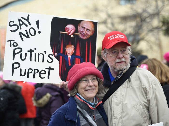 Sandy Cryder and Dan Norum of Baltimore took a dig at the president with their sign that showed Trump as a puppet controlled by Russian President Vladimir Putin.