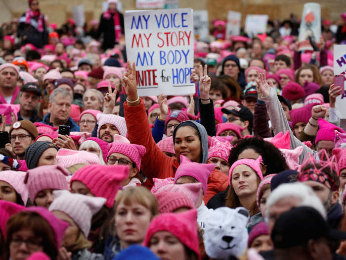 A pink knitted beanie, known as the "pussy hat," became a symbol of solidarity among protestors. Knitting parties organized in the weeks before the march.