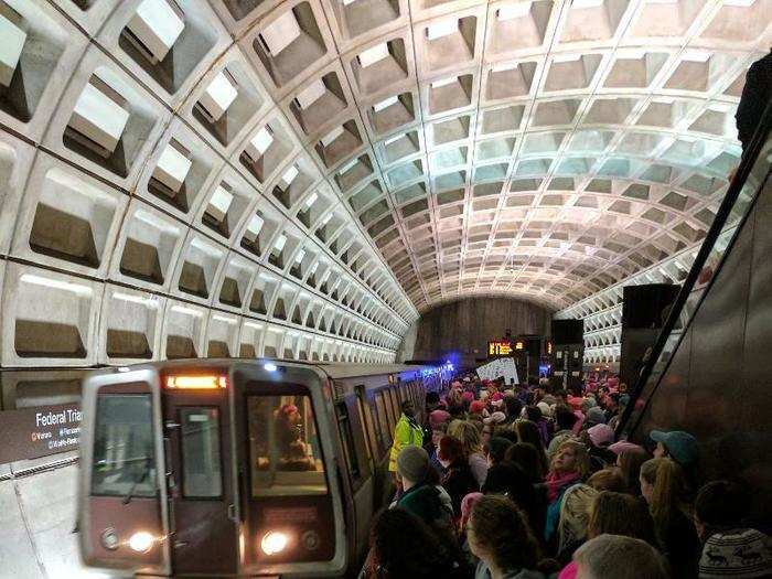 ... and poured into a dense crowd that pushed toward the edge of the platform.