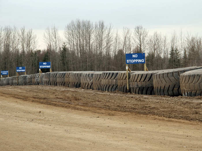 At 13 feet wide and 12,000 pounds each, 797-tires are a burden to dispose of — so they