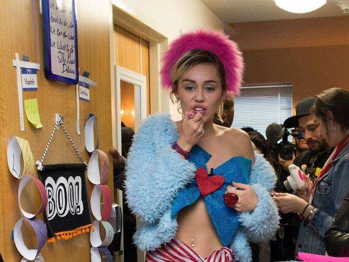 Miley took to dorm rooms to campaign for Hilary Clinton in October 2016 wearing a haphazard, patriotic look.