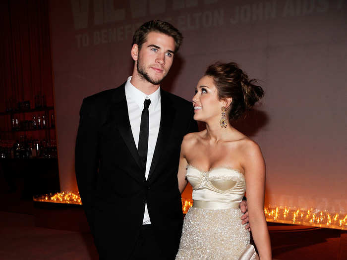 For the 2010 Academy Awards, she hit the red carpet with her beau Liam Hemsworth in a shimmering Jenny Packman dress, which later became one of her most iconic looks.