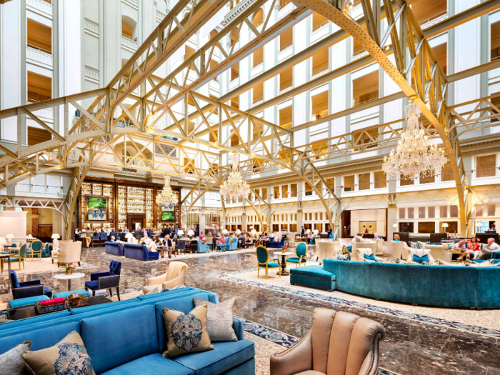 Crystal chandeliers hang in the lobby. The hotel