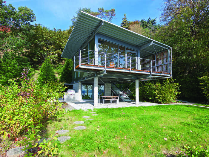 Also made of steel shipping containers, the eHab house sits next to a lake in Seattle Washington. The galvanized exteriors were sprayed with a coating that protects against weathering and rust.