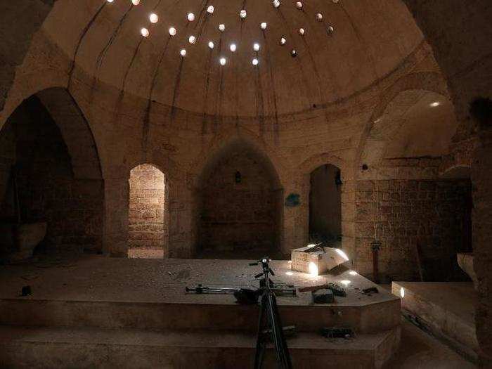 Tripods and a projector were left inside an ancient hammam, or steam bath, which was used by ISIS as a media center in Manbij, Syria.