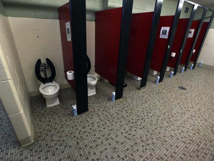 No, toilets do not have doors. This is so recruits can