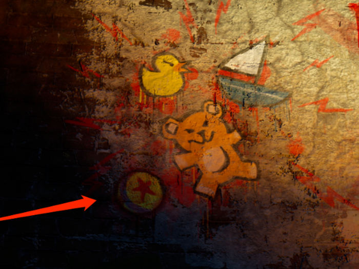 The Luxo ball can be seen in graffiti on the wall behind two characters during the Scare Games