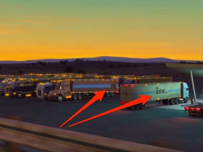 Numerous trucks seen at a pitstop have references to several Pixar movies. There