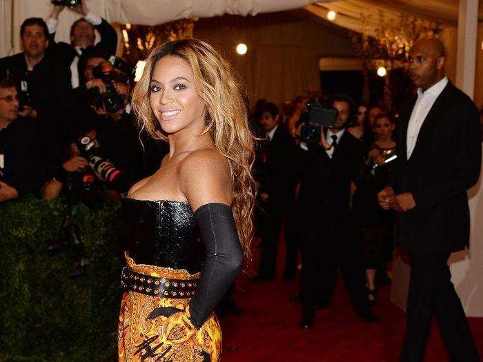 Beyoncé went with a black and gold dress and matching boots for the 2013 Met Gala. The theme? PUNK: Chaos to Couture.